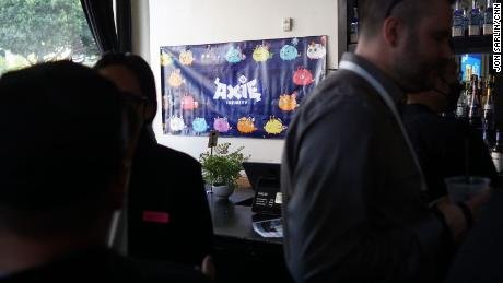 An Axie Infinity poster hangs at a meet-up in Los Angeles, California.