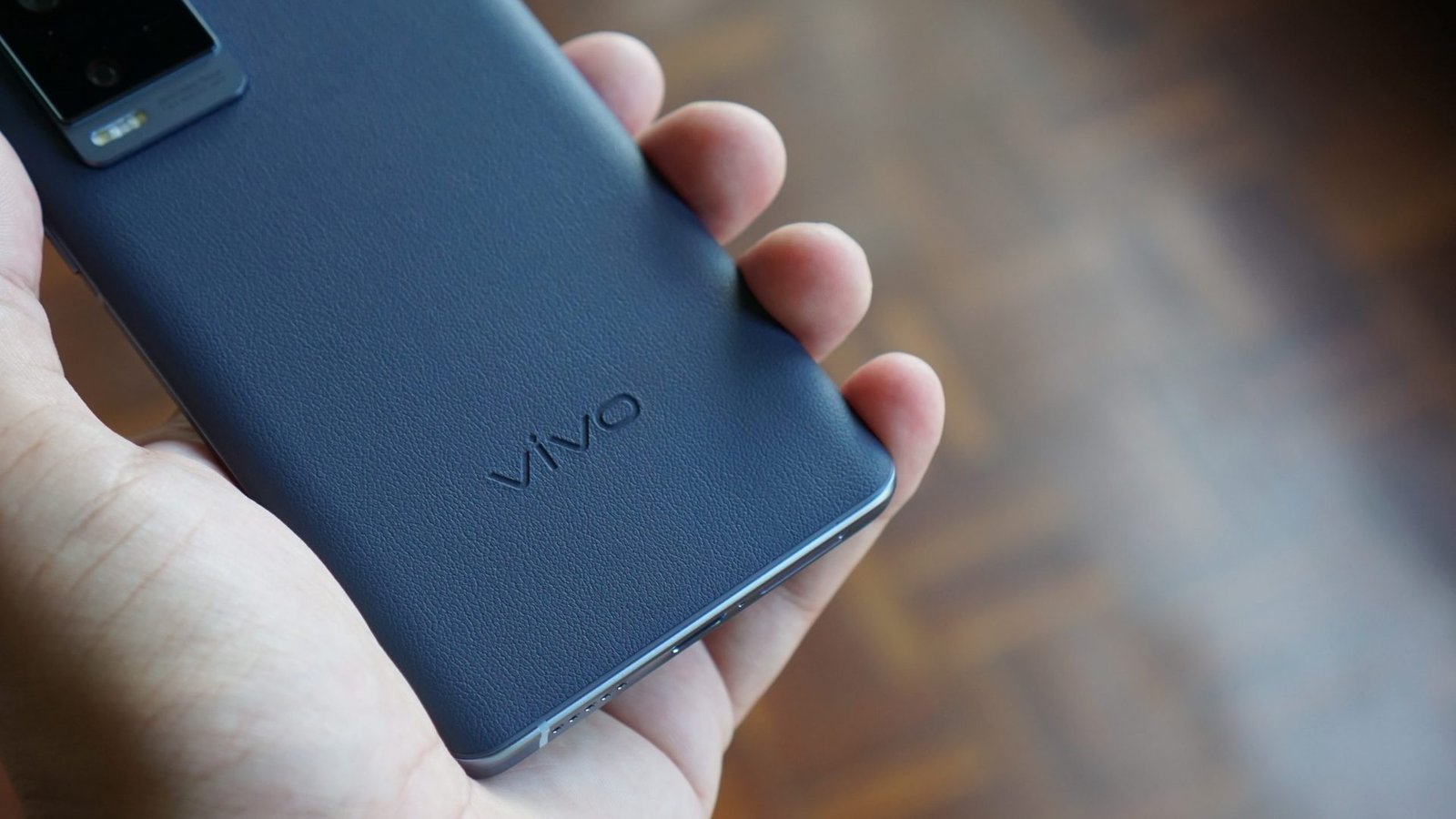 Vivo X60 Pro Plus logo Vivo X60 Pro Plus in hand showing logo and rear of phone