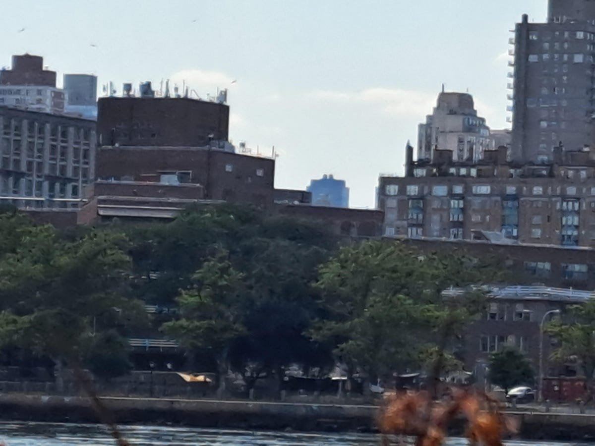 Google Pixel 6A Review: The Best Android Phone Under $500 19 A zoomed-in photo of buildings behind a river taken with the Galaxy A53.