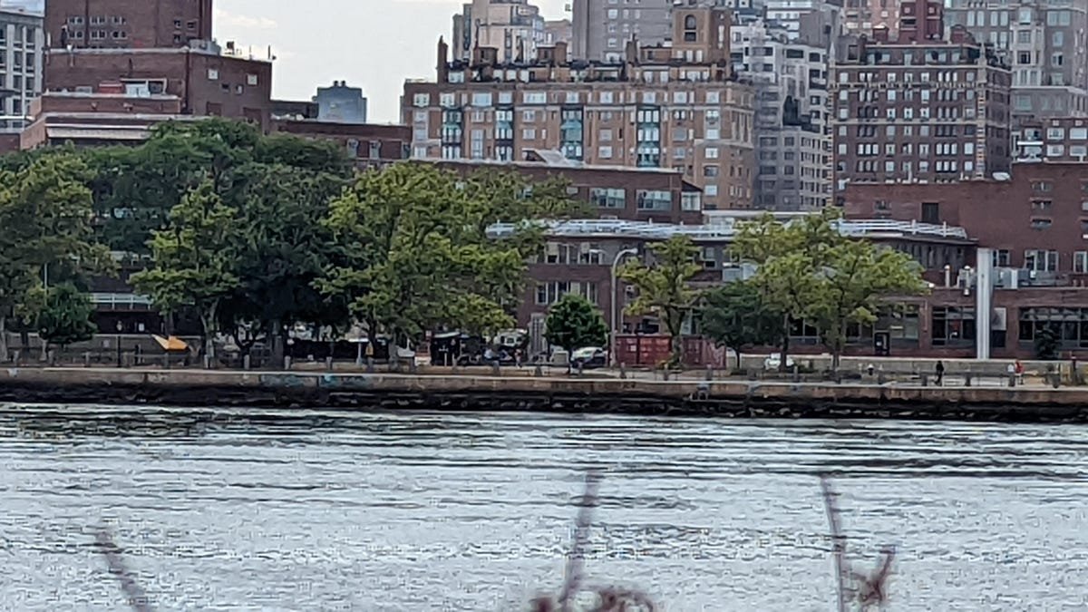 Google Pixel 6A Review: The Best Android Phone Under $500 18 A zoomed-in photo of buildings behind a river taken with the Pixel 6.