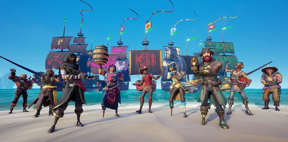 Des joueurs debout sur une plage pour commémorer la mise à jour de la capitainerie de Sea of ​​​​Thieves