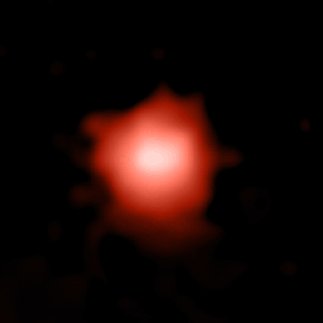 Une image d'une tache rouge contre l'obscurité d'encreune galaxie lointaine capturée par le télescope spatial James Webb