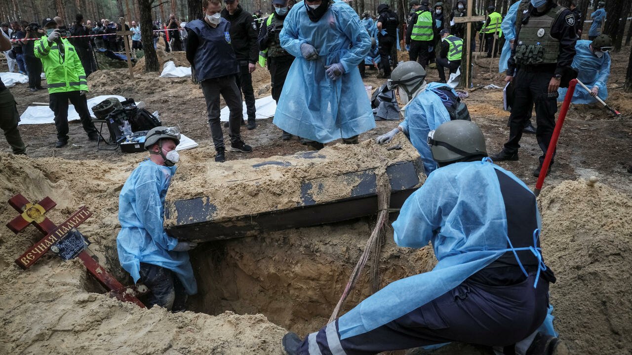Ukraine combs mass grave in Izium, says signs of torture found