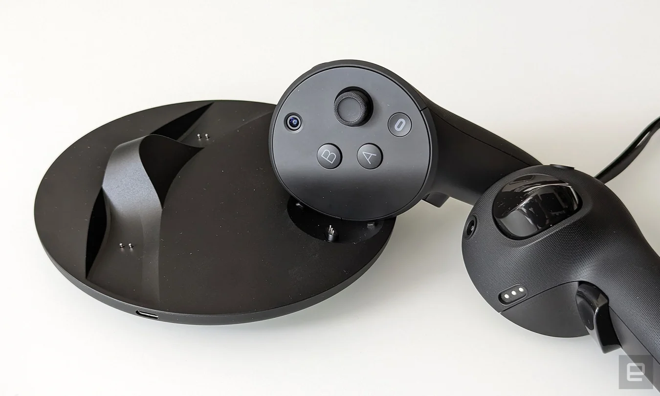 Seating the controllers is best done by turning them inwards and then dropping them on the dock.