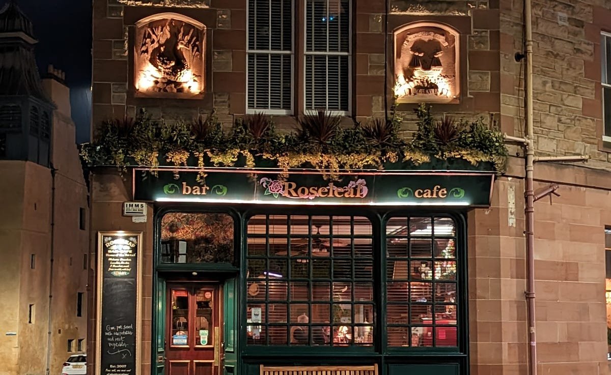 iPhone 14 Pro vs. Pixel 7 Pro, Galaxy S22 Ultra: The Night Mode Test 14 The Roseleaf bar at night cropped in