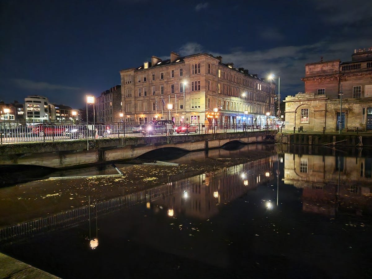 Street lights reflected on a river at night