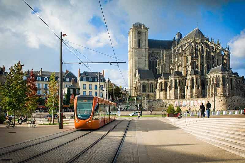 orange tram at a Le mans, France