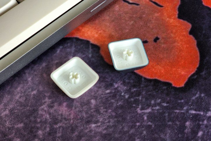 Lofree Flow dye-subimation PBT low profile mechanical keyboard keycaps kept inverted on a desk.