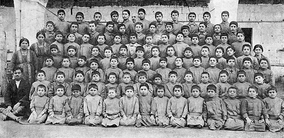 Missak Manouchian (near the cross) at the orphanage in Jounieh, Lebanon in 1919.