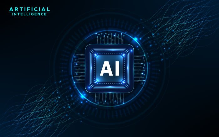 Rendu numérique d'une puce informatique avec une IA inscrite au centre, sur fond bleu.