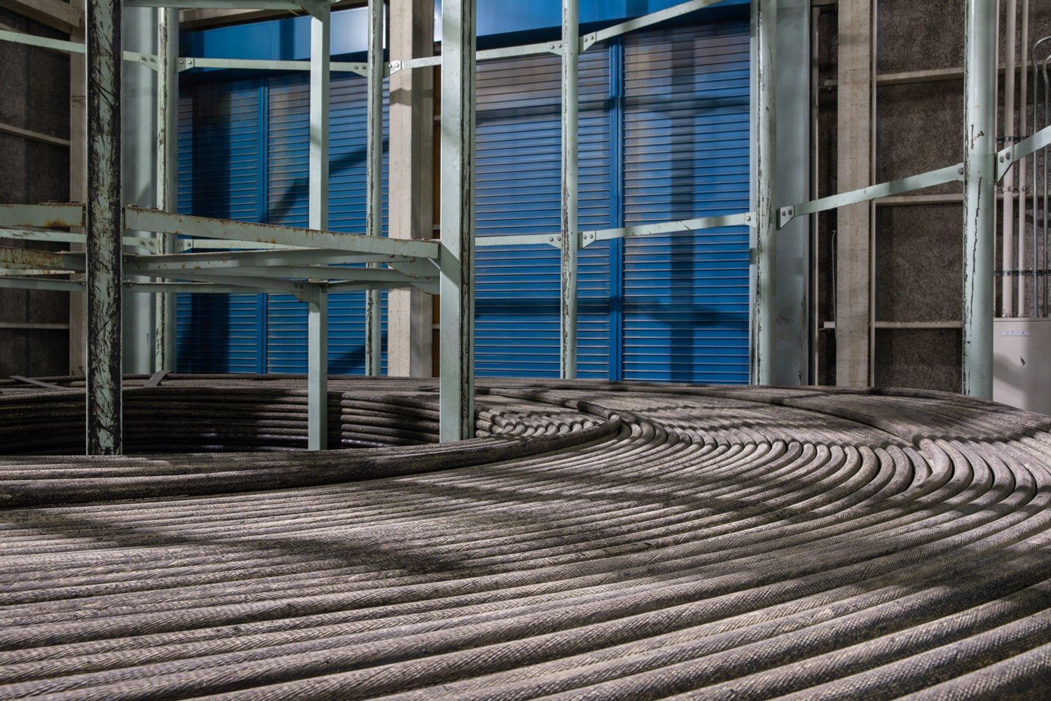 Cables are wrapped around a large metal structure in the KCS depot.