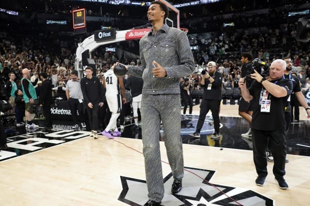 Apr 14, 2024; San Antonio, Texas, USA; San Antonio Spurs forward Victor Wembanyama (1) prepares to throw a ball to fans after the final game of the season against the Detroit Pistons at Frost Bank Center.