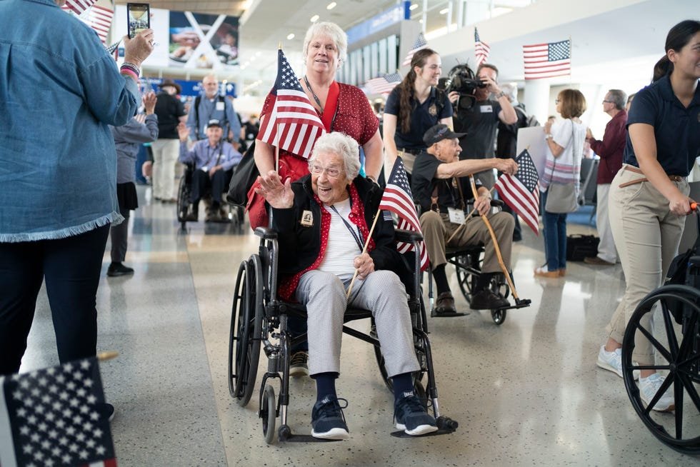 More than 60 veterans prepare to board a chartered Boeing 787 provided by American Airlines, flying from Dallas to France on May 31, 2024. The party included six Medal of Honor winners from wars in Iraq, Afghanistan and Vietnam and two Rosie the Riveters, women who made invaluable contributions to the war effort by working in factories and shipyards. In total, some 280 people would make up the entourage.