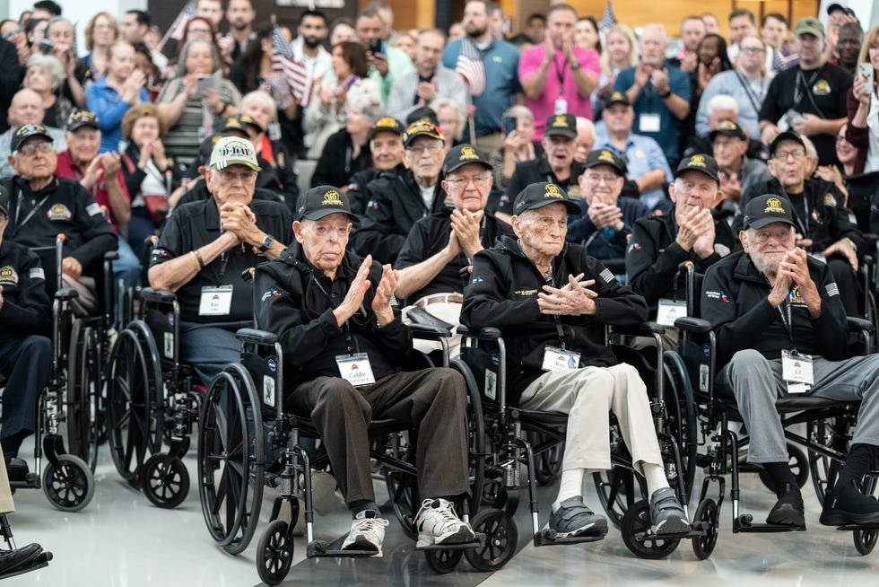 The veterans gather the day before their flight.